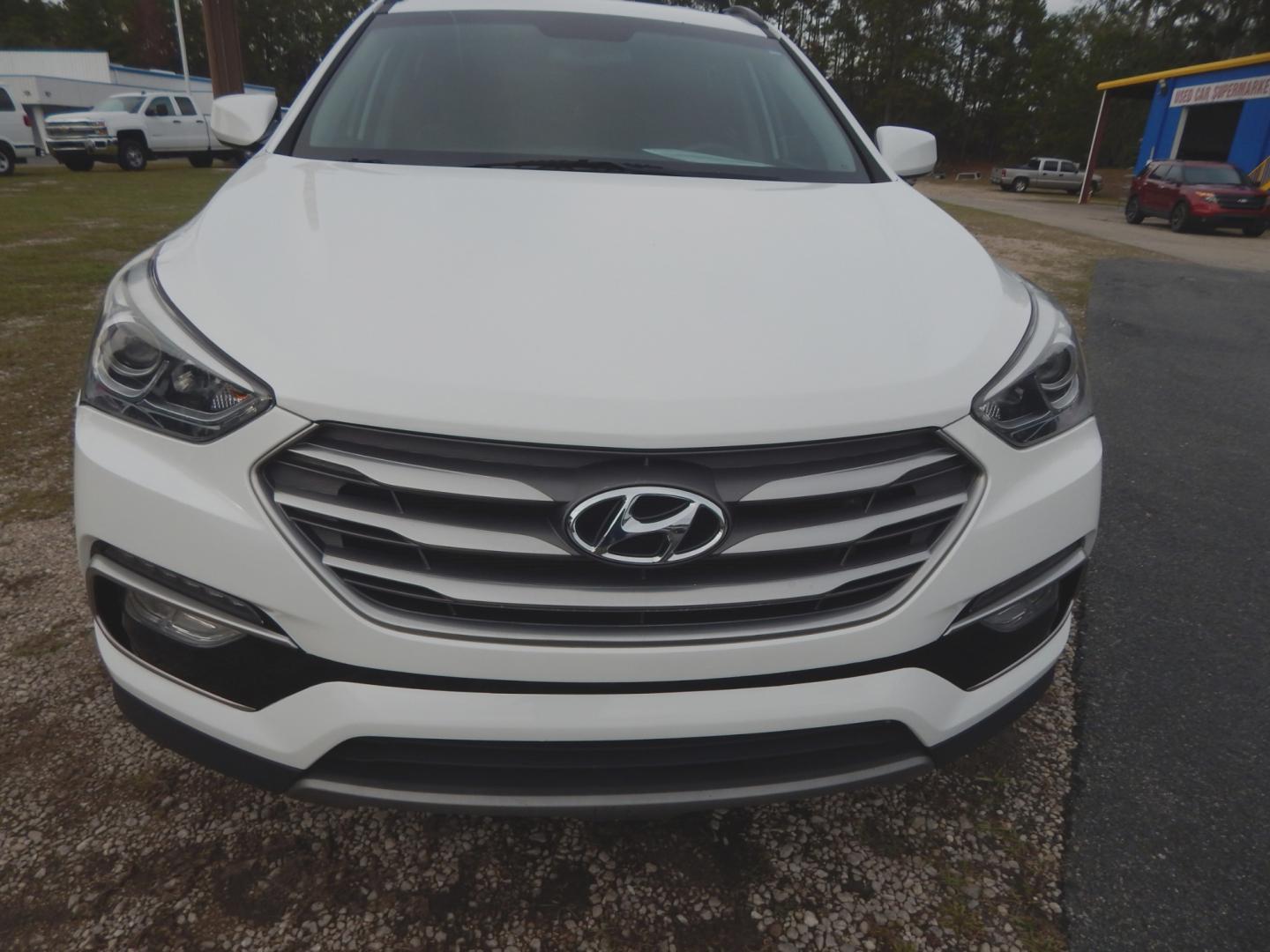 2017 White /Gray Hyundai Santa Fe Sport (5NMZU3LB8HH) with an 2.4L engine, Automatic transmission, located at 3120 W Tennessee St, Tallahassee, FL, 32304-1002, (850) 575-6702, 30.458841, -84.349648 - Used Car Supermarket is proud to present you with this loaded immaculate 2017 Hyundai Santa Fe Sport with low miles. Used Car Supermarket prides itself in offering you the finest pre-owned vehicle in Tallahassee. Used Car Supermarket has been locally family owned and operated for over 48 years. Our - Photo#2